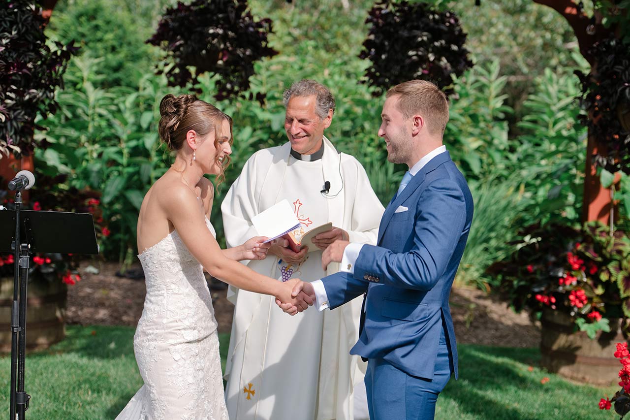 Bride and groom exchanging vows during their Publick House wedding ceremony in Sturbridge MA