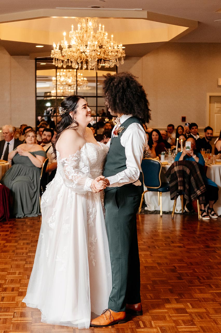 Newlyweds sharing their first dance during a wedding reception at The Delaney House in Holyoke, MA