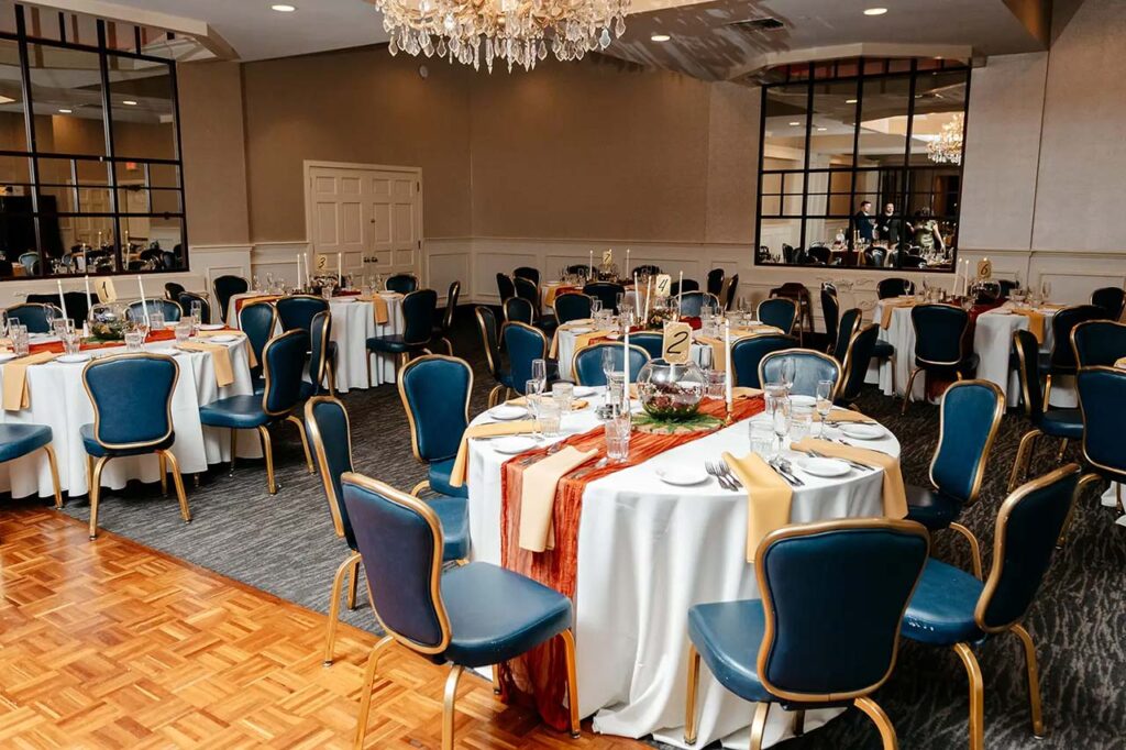 Wedding reception tables prepared inside The Delaney House in Holyoke, Massachusetts