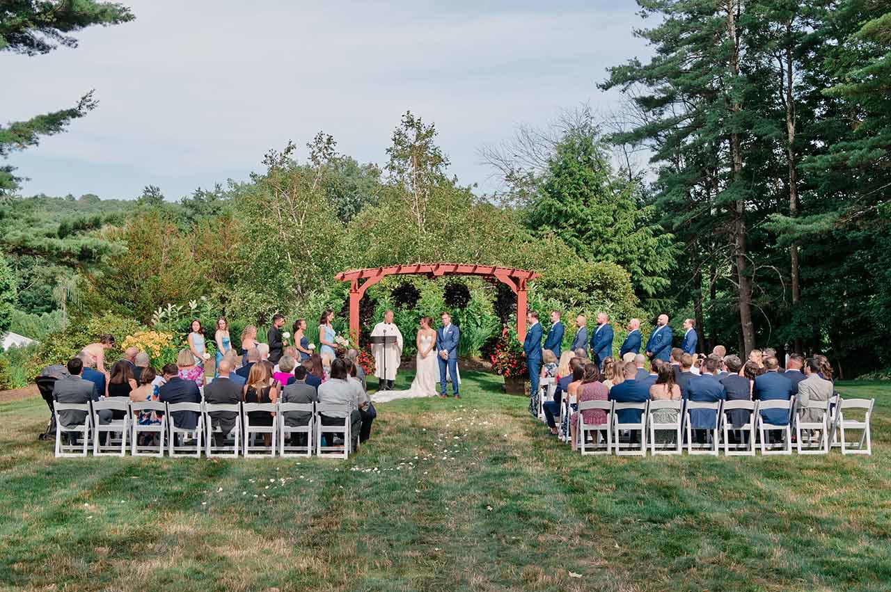 Outdoor wedding ceremony at Publick House Historic Inn in Sturbr