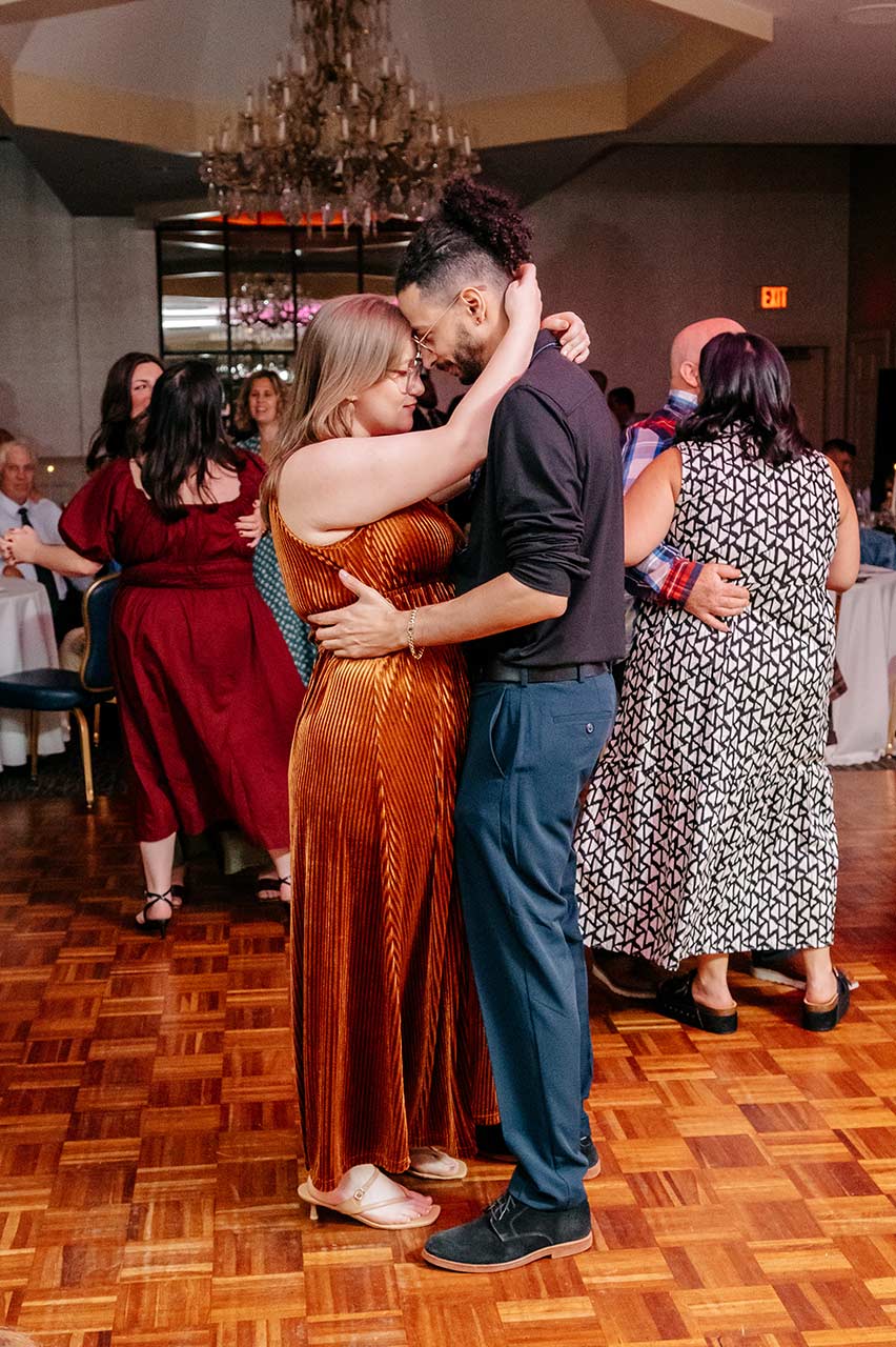 Wedding guests dancing together on the reception dance floor during a Massachusetts wedding celebration